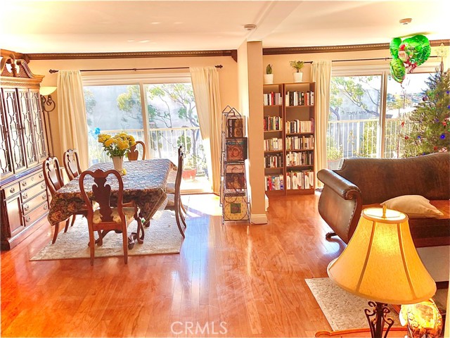 Spacious view of the Dining Room and Living Room from the Entrance.