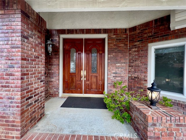 Grand entry with hardwood double doors!