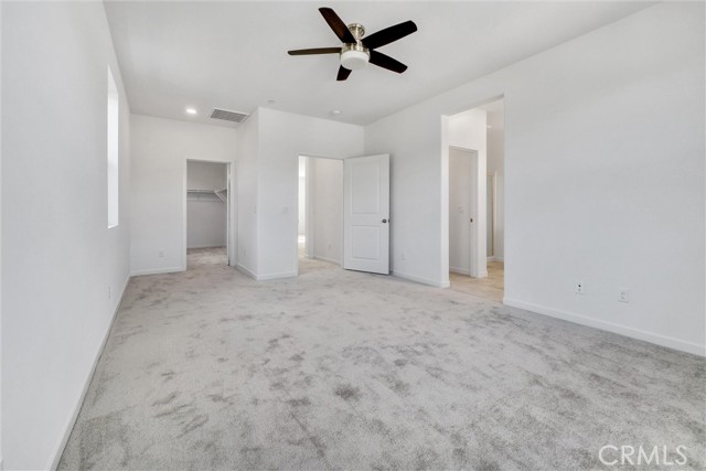 Primary suite with view of bathroom and closet