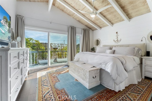 Primary bedroom with king bed and open up to ocean view deck