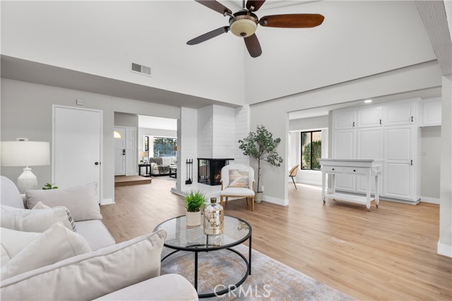 Family room with central fireplace.