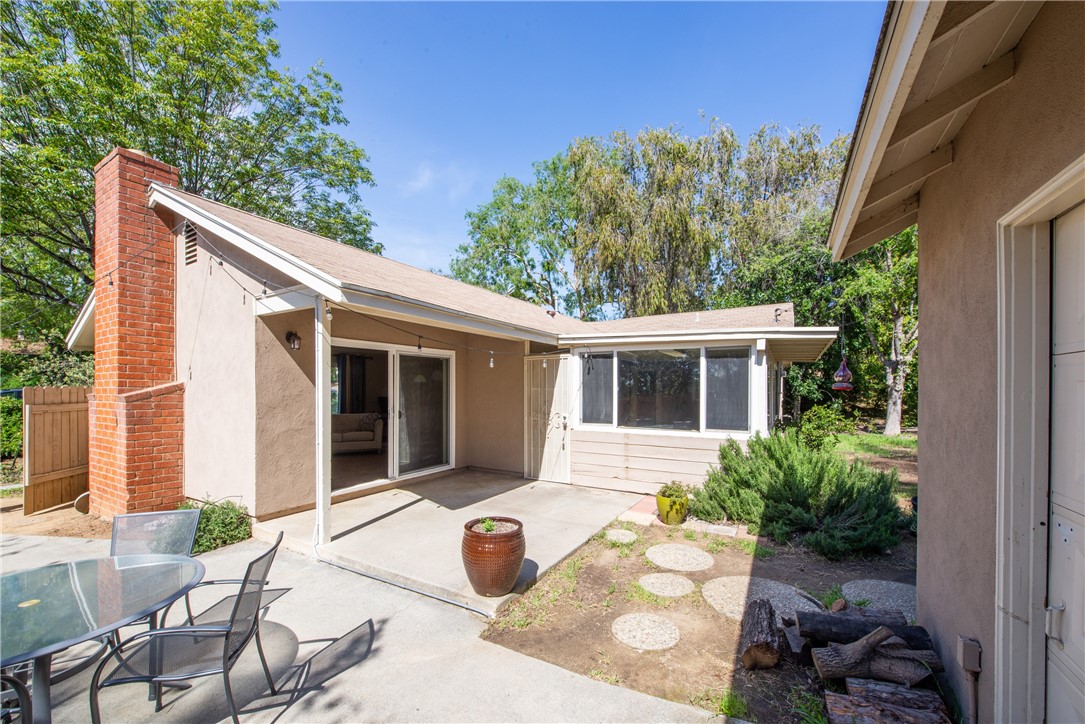 Entering the backyard is easy from either the home or the sunroom.