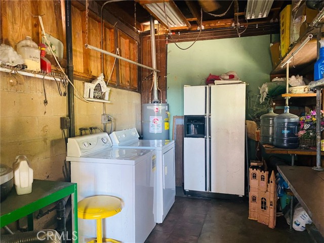 Separate laundry/storage room.