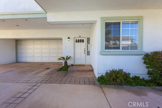 Front door; attached two car garage