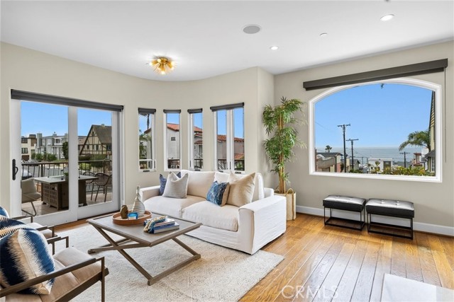 Main living area with tons of light and a wrap around patio for indoor outdoor living