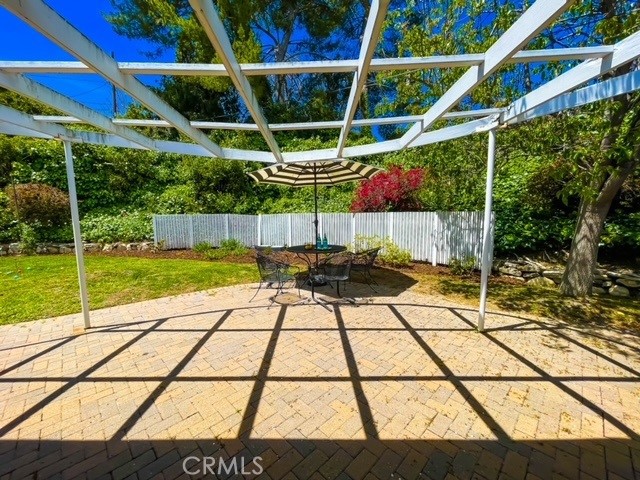 View of brick ribboned patio from the kitchen/family room.