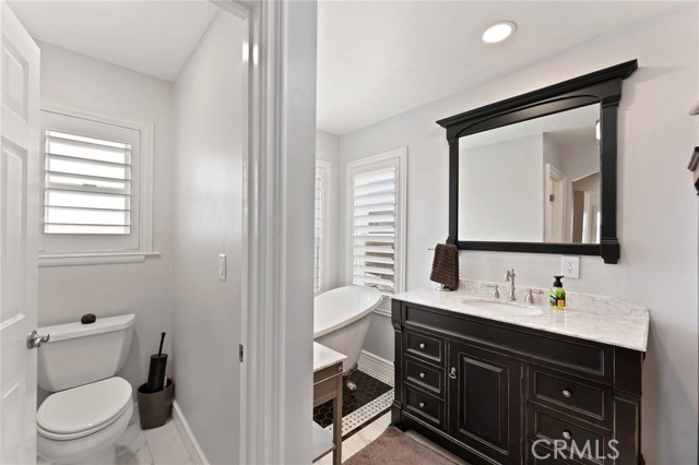 Main bath with clawfoot tub and walk in shower