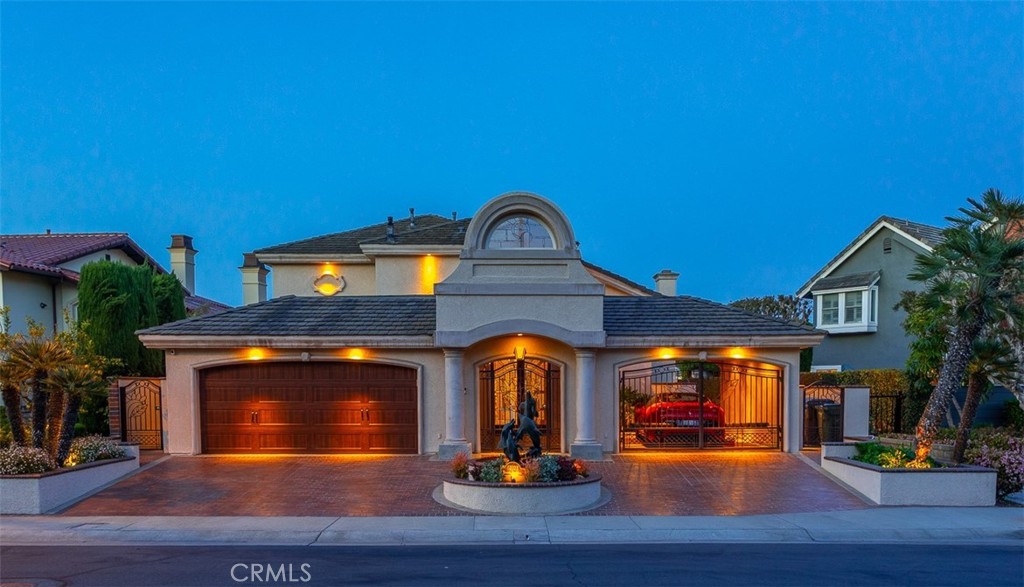 Waterfront Luxury in Coral Cay – Where Sophistication Meets Coastal Living. Welcome to one of Huntington Harbour’s most coveted addresses—nestled within the prestigious 24-hour guard-gated community of Coral Cay. This is more than a home—it’s a lifestyle. Set on a prime 5,800+ sq. ft. lot with direct Main Channel frontage, this nearly 4,000 sq. ft. custom estate was thoughtfully rebuilt from the ground up in 2001, blending timeless elegance with a fresh, modern edge. Step inside and be greeted by sweeping water views, soaring ceilings, and walls of glass that invite natural light to pour in from every angle. The open-concept floor plan flows effortlessly, perfect for both everyday living and unforgettable entertaining. A show-stopping curved glass staircase sets the tone for the refined architecture throughout, while rich hardwood floors and sleek stone accents bring warmth and sophistication to every room. The chef’s kitchen is a dream come true outfitted with a Wolf range, Sub-Zero refrigerators, and high-end appliances designed to make every meal an experience. Entertain in style at the full bar, complete with a 175-gallon exotic fish tank that adds a splash of drama and charm to the space.  Upstairs, the primary suite is a private sanctuary with postcard-worthy waterfront views, a spa-like bath featuring a sculptural soaking tub, an elegantly curved glass shower, and luxurious finishes that offer a daily retreat from the world. Every detail has been considered for comfort and convenience—tankless water heater, dual-zone HVAC, a whole-home generator, and soft water system included.  Outside, your private waterfront terrace awaits. Enjoy sunny afternoons by the plunge pool and spa, or set sail from your own deep-water dock, which can accommodate a yacht over 45 feet. Coral Cay residents also enjoy access to a private beach, tennis and pickleball courts, and a truly exclusive coastal lifestyle. Just a short walk to Sunset Beach and moments from dining, shopping, and the annual Huntington Harbour Boat Parade, this home is the perfect blend of luxury, location, and laid-back elegance. This is a rare opportunity to own one of Coral Cay’s finest waterfront homes—don’t miss it.