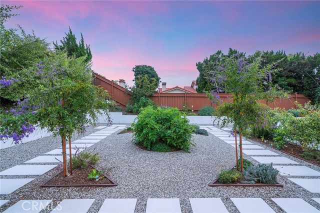 Lots of garden vegetables surround this backyard
