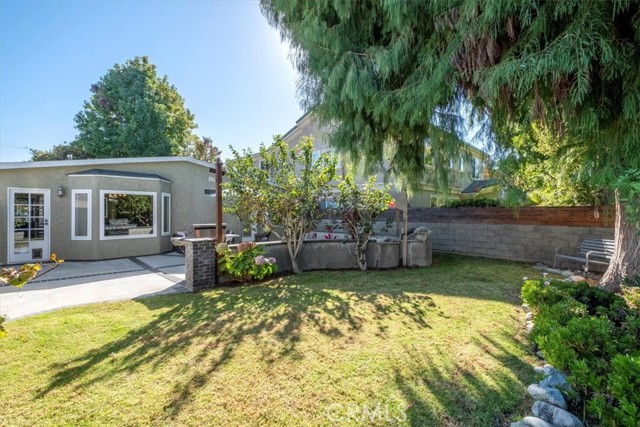 Spacious Grassy Area behind Spa and Pond