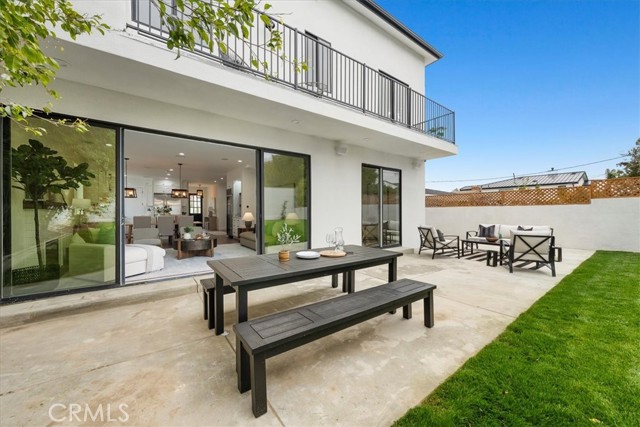 Backyard with view into living area and downstairs bedroom.