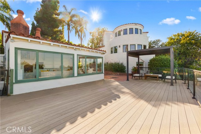 The view of 6401 Corsini Pl from the deck looking into the 320 sq.ft. studio.