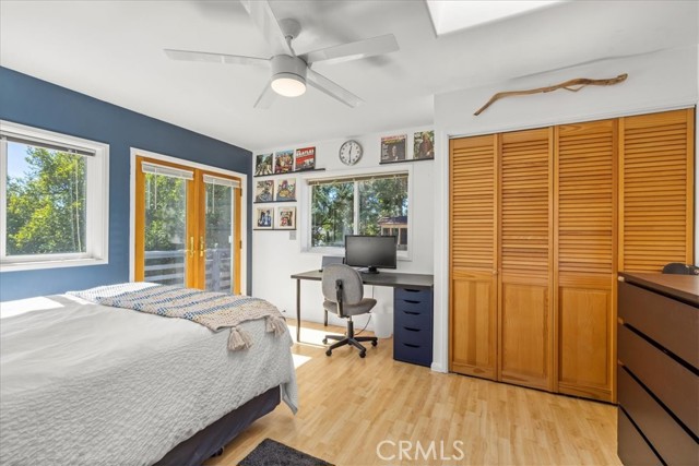 Plenty of space for desk, dresser and good sized closet. Notice skylight and new ceiling fan