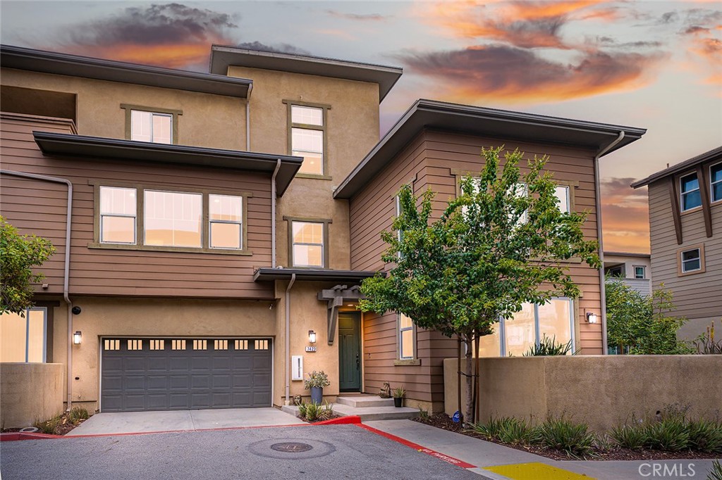 Located in the upscale Day Creek Square community, this newly painted gorgeous END-UNIT condo encompasses a perfect blend of rustic and modern feel featuring great amenities such as 2 loft areas & a top floor GRAND PRIVATE BALCONY offering an expanded outdoor space for entertaining & relaxing! Upon entry, be amazed by the height of the 2-story sun-filled living room with numerous windows bringing the outdoors in with a view of the pool.  This home is styled in the rustic look of brick accent walls, luxurious wood-like flooring pairing perfectly with modern accents of black, chrome, stainless steel, quartz, granite and upgraded gleaming lighting fixtures.  Ready for a quick dip in the pool?  The pool is close enough for easy access but far enough away to minimize the noise. The open-plan design, combining kitchen, dining, and living spaces, creates a wonderful space for gathering and entertaining. Chef’s delight kitchen offers a huge island, stainless steel appliances, sleek black cabinetry, subway tile and granite countertop in swirly tones of black, grey and white, 5-burner gas cooktop with deluxe hood and a farm sink. Counter seating also adds to the optimal flow of the main floor along with a convenient guest powder room. Ascend the stairs to second floor to find a sizable loft with brick accent wall, secondary bedroom with adjacent full bathroom, a sizable sun-filled primary suite with an eye-catching wainscot accent wall, a bathroom featuring double sinks, soaking tub, walk-in shower and a closet with built-in organizers. Third floor features an additional secondary bedroom with an adjacent full bathroom and another large loft leading out to a grand balcony, an extension of the indoor space boasting of a brand new artificial turf, XL seating area and a sauna desgined for relaxation. Grab your favorite drink watch the sun go down and the stars light up in own private deck. Other notable features include LED lighting throughout for energy efficiency, 220V outlet for electric vehile charging & nearby award-winning schools. Community amenities boasts of a sparkling pool/spa, the “Plaza” - a hangout area for families and friends, picnic area with BBQ, bocce ball courts, seating areas to play chess games and a children’s playground. Within short walking distance are major shopping stores such as Sprouts, Stater Bros, CVS and the famous Victoria Gardens outdoor mall.Come and grab the opportunity to experience the loft-syle living with all the conveniences!