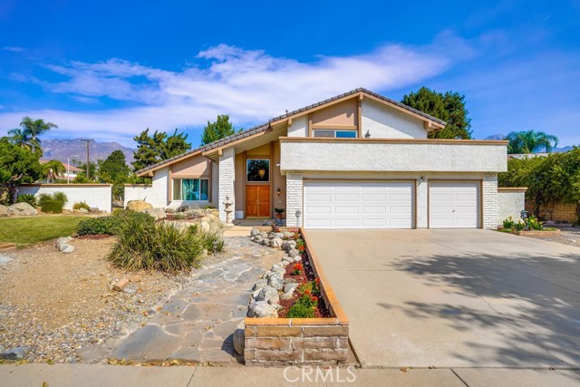 785 Cabot Court Upland, California Location, Location, Location! Beautiful Pool home on Large Corner Lot with Views out each window. This street has only three homes on the cold-e-sac giving you maximum Privacy. With an expansive double door entry, Vaulted ceilings in the living room, large windows which bring in lots of natural light. Formal Dining room, eat in kitchen. Step down Family room with Large romantic fireplace and wet bar for entertaining. First floor bedroom and bathroom for guests. Three generous sized bedrooms upstairs. The Master ensuite is a retreat in itself with a large balcony and separate his and hers vanities in the master bathroom. The bathrooms have been tastefully remodeled throughout. The back yard features a sparkling pool and a Koi pond that is waiting for someone to refresh and bring their dream yard to life. This home has never been on the market and won't last.