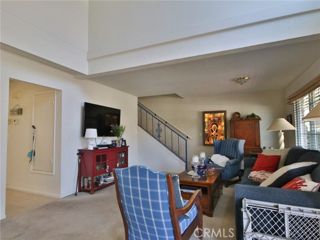 Another look at the living room showing the hall to the back of the unit, with the kitchen and family room