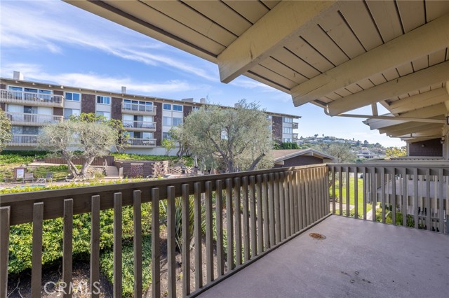 spacious balcony overlooking the HOA pool