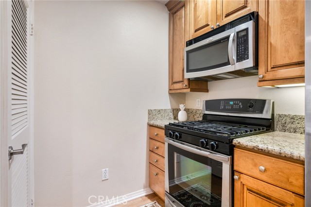 Stackable Washer & Dryer in Closet opposite stove