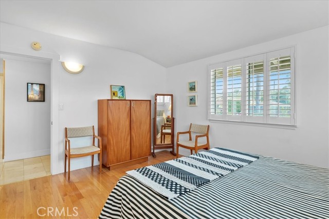 Master suite with wood floors.