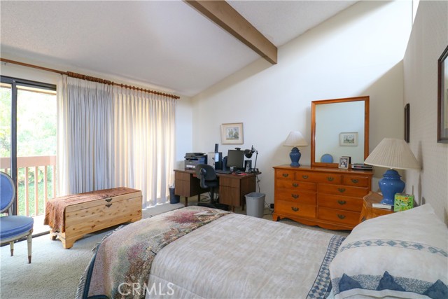 Master suite with balcony looking west toward backyard.