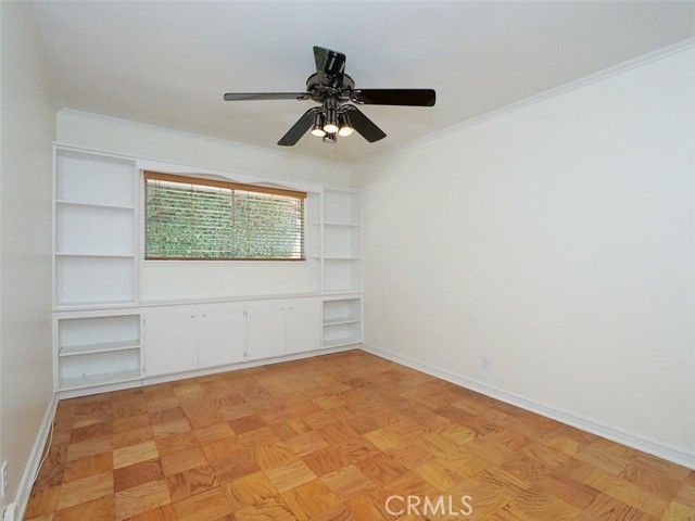 Bedroom 3 with built-ins, dark color ceiling fan and refinished floors and fresh paint