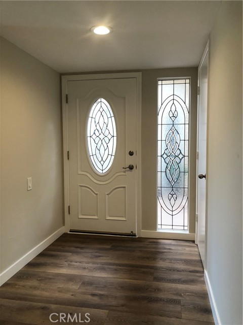 Welcome to 3246-P --Beautiful inside view of foyer showing beautiful entrance door with leaded glass door and matching side panel.