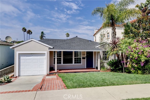 Welcoming brick front porch leads you to this 4 bedroom 2 bath home with stunning primary spa bath.