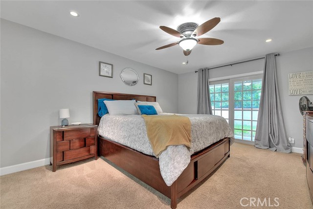 Primary Bedroom with sliders to back covered patio