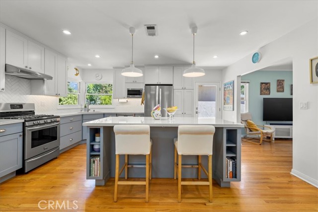 Gorgeous newer 2-tone kitchen with stainless appliances. Neat, clean and so much storage!