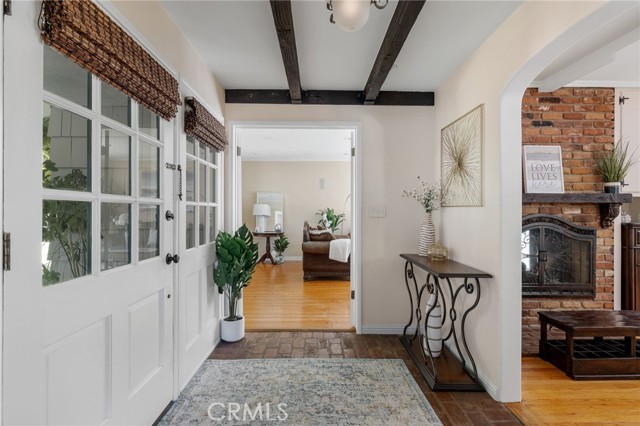 Formal living room is seen through French doors.