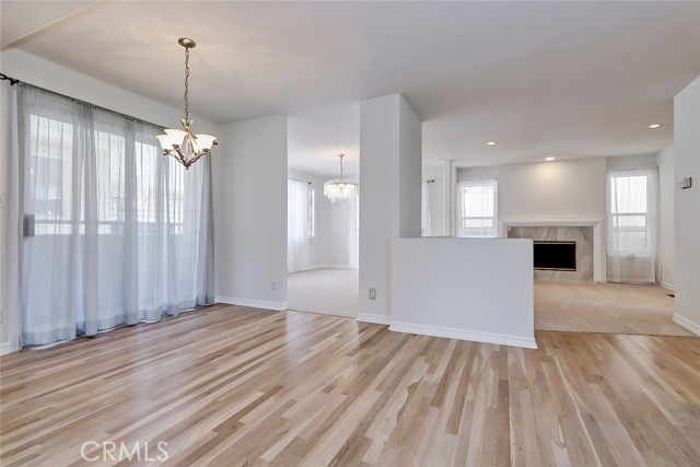 Formal dining and living room open to kitchen.