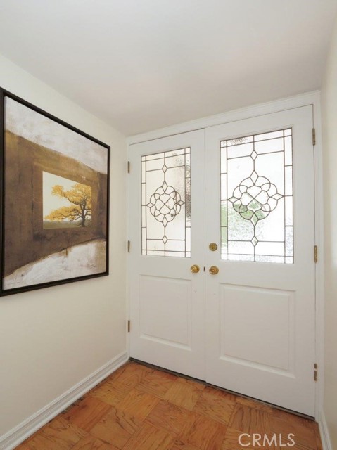 Let's go bak inside through the leaded beveled glass double door entry with refinished wood floors and fresh paint.