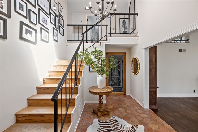 Dramatic foyer with a skylight that bathes the space in natural light.