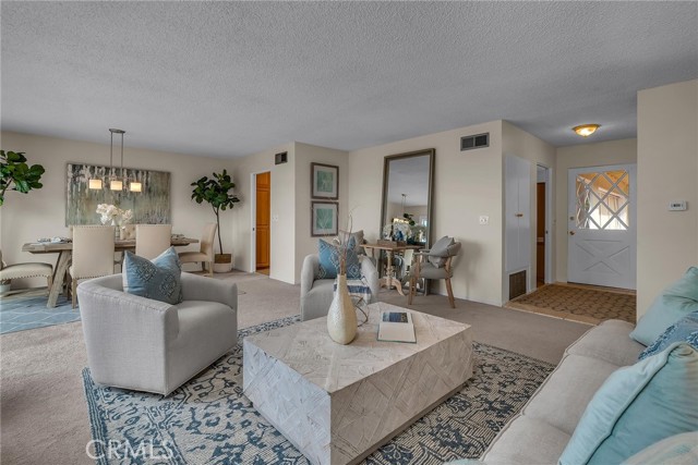 Spacious living room adjoins dining area