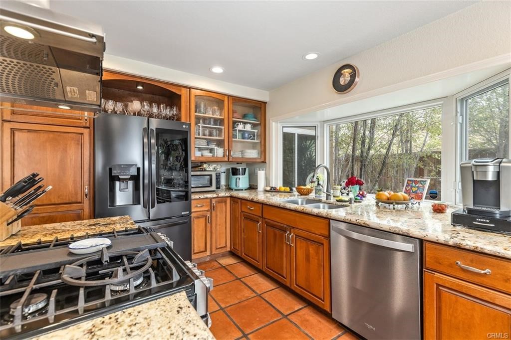 Kitchen is upgraded with granite counter tops, newer stainless steel appliances, and center island.