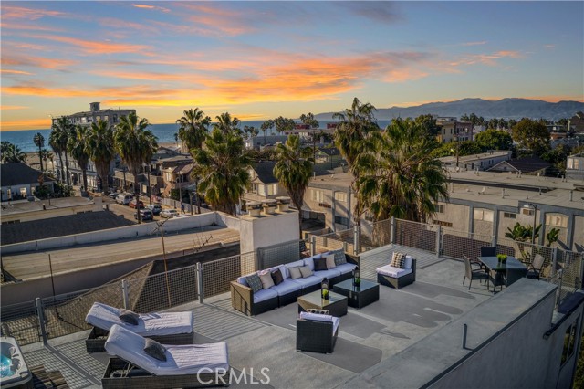 46 Rose Avenue Venice, California Location - Location - Location: Soho meets Venice Beach! One block from the sand. Two open and airy homes totaling an amazing 4,626 sq. ft. with an industrial architectural spin. Built by Hope Alexander, renowned Venice Architect and daughter of famous California artist Peter Alexander. The upper unit #2, is an expansive 2 bedroom, 2 bath & 2,400 sq. ft. Private staircase provides access to an enormous rooftop deck with jacuzzi & lounge area, offering prime sunset-viewing with its 360-degree panoramic views of the San Bernardino mountains and the ocean. The industrial architecture features high ceilings, skylights, floor-to-ceiling windows, finished concrete floors, wide-open kitchen, fireplace, no walls or hallways, and a dumbwaiter elevator. The lower unit #1 is 2,226 sq. ft. is currently 1 bedroom, den and 2 baths—of course the den could be a bedroom. The property can be converted to one extraordinary single-family residence (buyer to verify).
Gated four car parking (2 each unit). This unique & contemporary space is next to the beach and Main Street. Short walking distance to both the Abbott Kinney Blvd. & Rose Avenue shopping districts, with its many upscale boutiques, shops, fine restaurants, and wine bars. On top of the other elements, this home is situated near Silicon Beach, Venice Canals, the award-winning Coeur d'Alene Elementary School, and the fabulous Claire Fountain-school. This is the best of Venice!