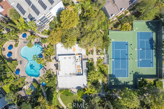 A skyview perspective of the Estates clubhouse, pool & spa and tennis courts.