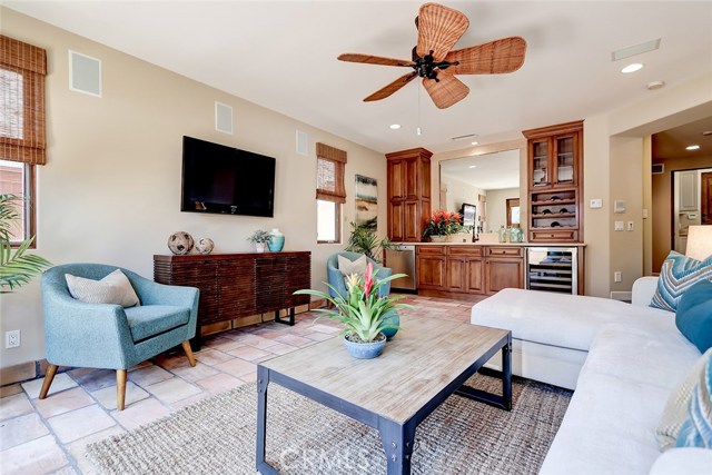 Lowest level family room is ideal for entertaining friends and family - built in dishwasher (why take those dishes upstairs?), wine refrigerator and sink!