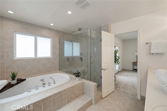 Primary Ensuite Bathroom with Tub and Shower