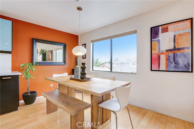 Large Dining Area that opens up to the open beamed living space.