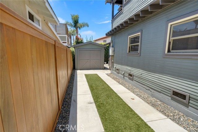 The driveway runs the length of the house and allows for off street secure parking and low maintenance.