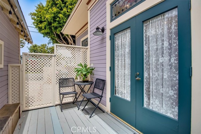 Enclosed porch adjacent to kitchen perfect for BBQing!