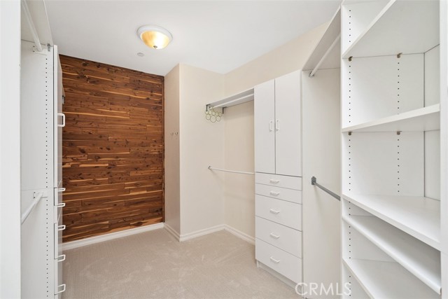 Custom primary closet with cedar planks