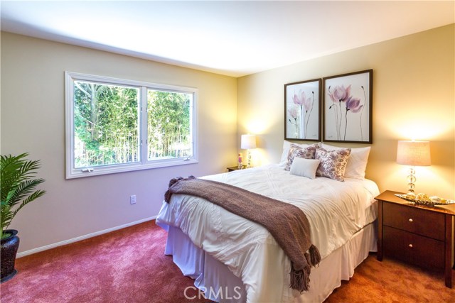 Downstairs bedroom with 3/4 bath across the hall