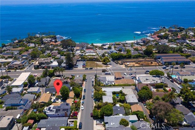 231 Cajon Street Laguna Beach, California Your own private compound located just 2 blocks from the beach in prestigious North Laguna! Four cottages plus a carriage house (5 units total), and a 4-car garage, on 2 legal lots totaling 9,000 square feet. The 4 stand-alone bungalows are independent, each with about 470 square feet including one bedroom, a full bath, vaulted beamed ceilings, wood floors, fireplace and a full kitchen. In addition, there is a 2-bedroom carriage house above the garage featuring ocean views and a large deck. Altogether this property comprises 6 bedrooms, 5 bathrooms, 5 full kitchens, 5 living rooms, 4 fireplaces, the 4-car garage, a laundry room and a workshop. There is additional parking in the driveway and off the alley in the back. The lot is street-to-alley, and would support either one or two single family homes, or up to 5 multi-family units as it is currently configured. Live in one unit and collect income from the others, or connect them, or use them as detached studios, offices or guest rooms. Garage access could be easily moved to the alley, enabling the open space of the lot to be fully utilized: there is plenty of room for a spa, fire pit, bocce court... The possibilities are endless! All this just moments from Crescent Bay and Shaws Cove, plus all the shops and restaurants of North Laguna! The property currently generates over $11,500 in monthly income, all tenants have been long term and are currently on month-to-month leases.