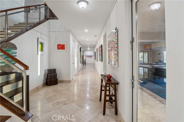 Downstairs Hall way leading to other rooms and Indoor Pool