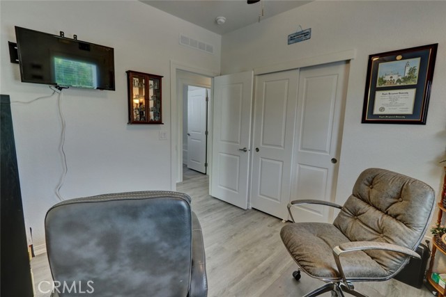 GUEST BEDROOM FEATURES A CEILING FAN AND DOUBLE CLOSET