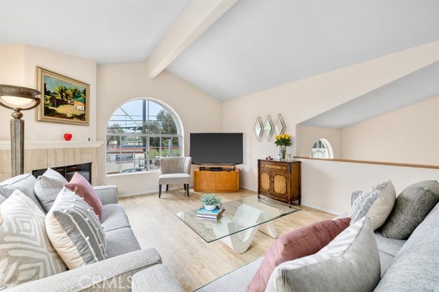 Light filled living room with vaulted ceiling