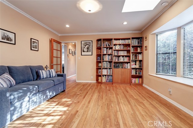 Secondary bedroom with hardwood floors and an en suite bath.