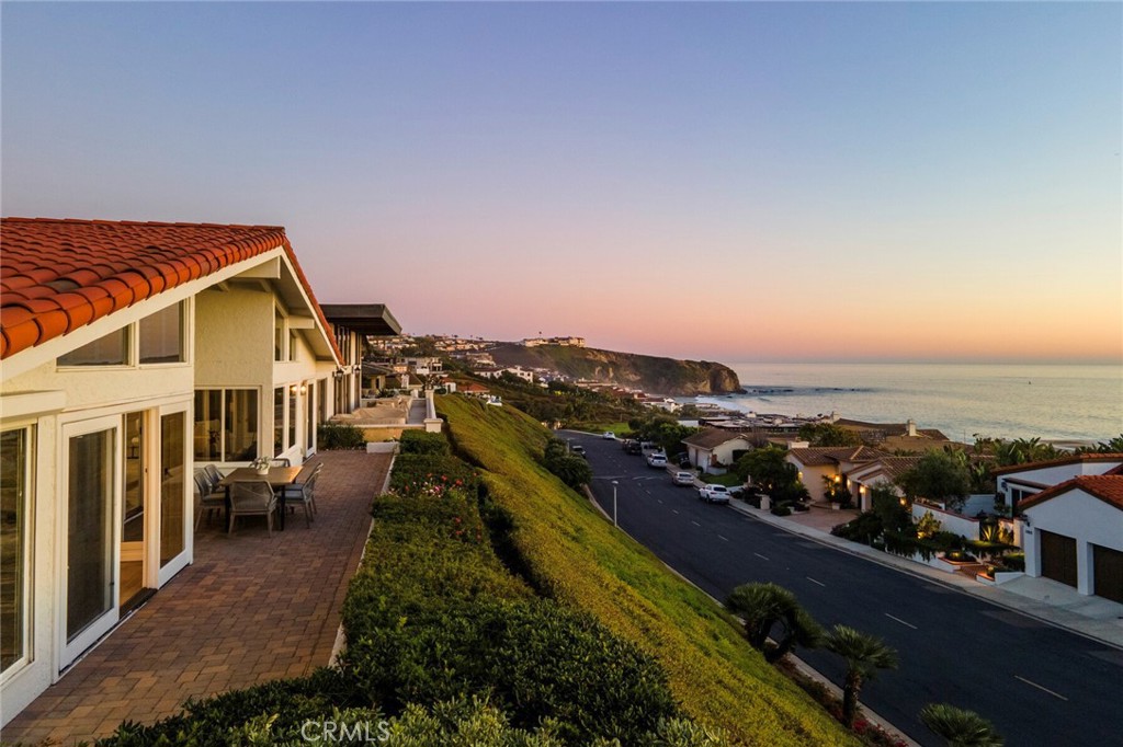 Turnkey single-level living with stunning 180 degree ocean views in exclusive, guard gated Niguel Shores. This remodeled custom home has vaulted ceilings that allow gorgeous natural light throughout the spacious floorplan. The thoughtful, open layout is wonderful for entertaining by virtue of the multiple connected spaces all with direct southwestern-facing views of the Pacific, crashing waves at Strands Point, and Catalina Island. The kitchen is upgraded with premium appliances and flows into the breakfast nook and is adjacent to the formal dining area. Proceed outside to the low maintenance patio to enjoy more of the sweeping ocean views. The primary suite is well situated and well appointed with high ceilings, a spa-like bath with an abundance of natural light, ocean views, a generous closet and doors that lead out to the back patio. Two additional bedrooms have direct access to the gated front courtyard and in-ground spa. 
Niguel Shores is one of the premier communities in South Orange County, complete with a bluff-front park above Strands Beach, private beach access, pickleball, tennis, clubhouse, a new pool and more. The ideal location in Monarch Beach puts you just steps away from the amenities of the Ritz Carlton, top-tier golf, Dana Point’s Lantern District and Marina and the world-class beaches of Laguna Beach, all with easy freeway access to put you within an hour of Los Angeles and San Diego.